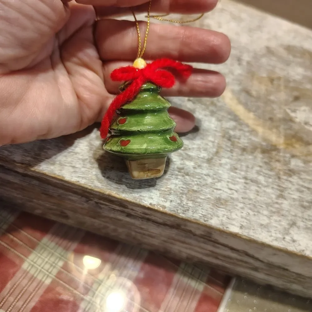 Festive Green Christmas Tree Ornament with Red Accents